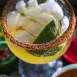 Cadillac Margarita with Pico de Gallo Chile rim served in a schooner glass. Recipe and cocktail photography By Jackie Alpers.