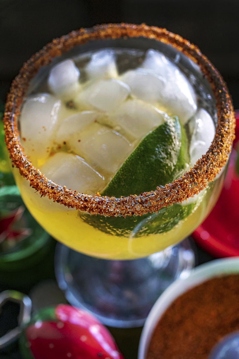 Cadillac Margarita with Pico de Gallo Chile rim served in a schooner glass. Recipe and cocktail photography By Jackie Alpers.