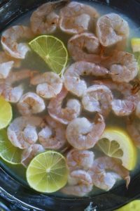 Raw shrimp marinating in citrus for ceviche