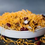Cincinnati Turkey chili made with turkey topped with cheese, onion, red kidney beans and hot sauce