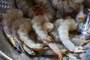 raw shrimp in colander