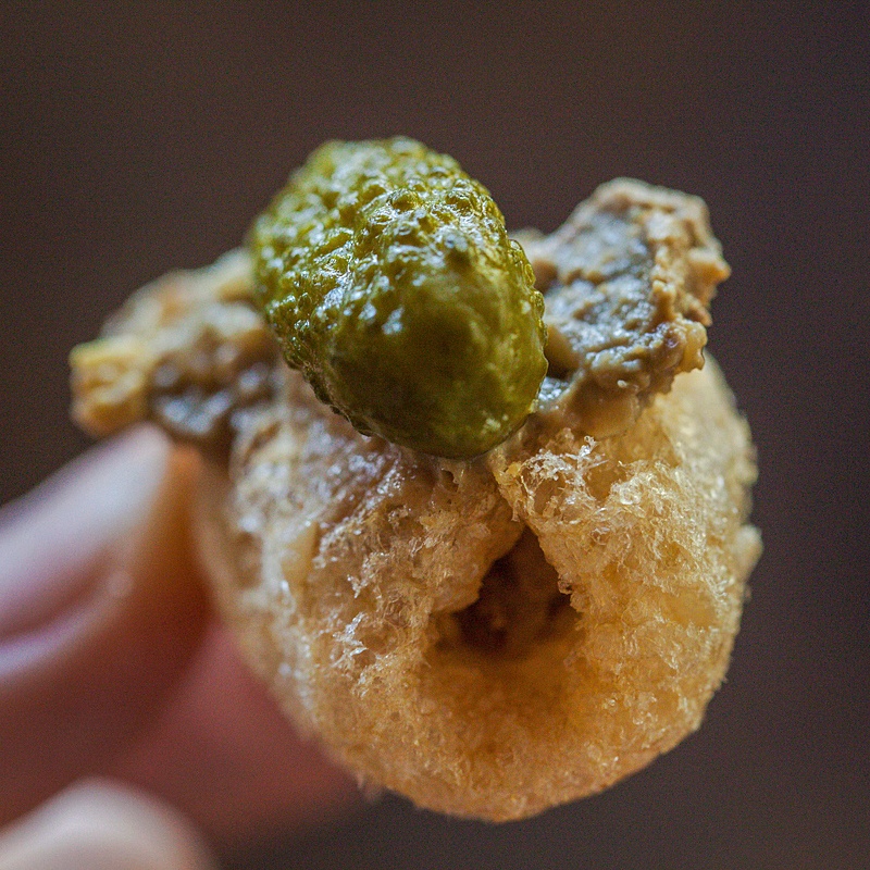 Chicken liver pate bites on pork rinds with pickles