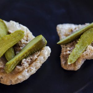 Chicken liver pate bites on pork rinds with pickles
