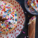 bagel topped with sprinkles cream cheese