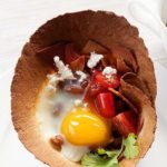 Pretty flour tortilla cups filled with eggs, bacon, pinto beans, cheese and salsa.