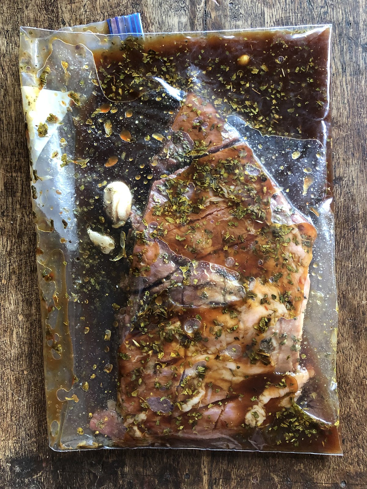 Sonoran style flank steak marinating in a resealable plastic bag