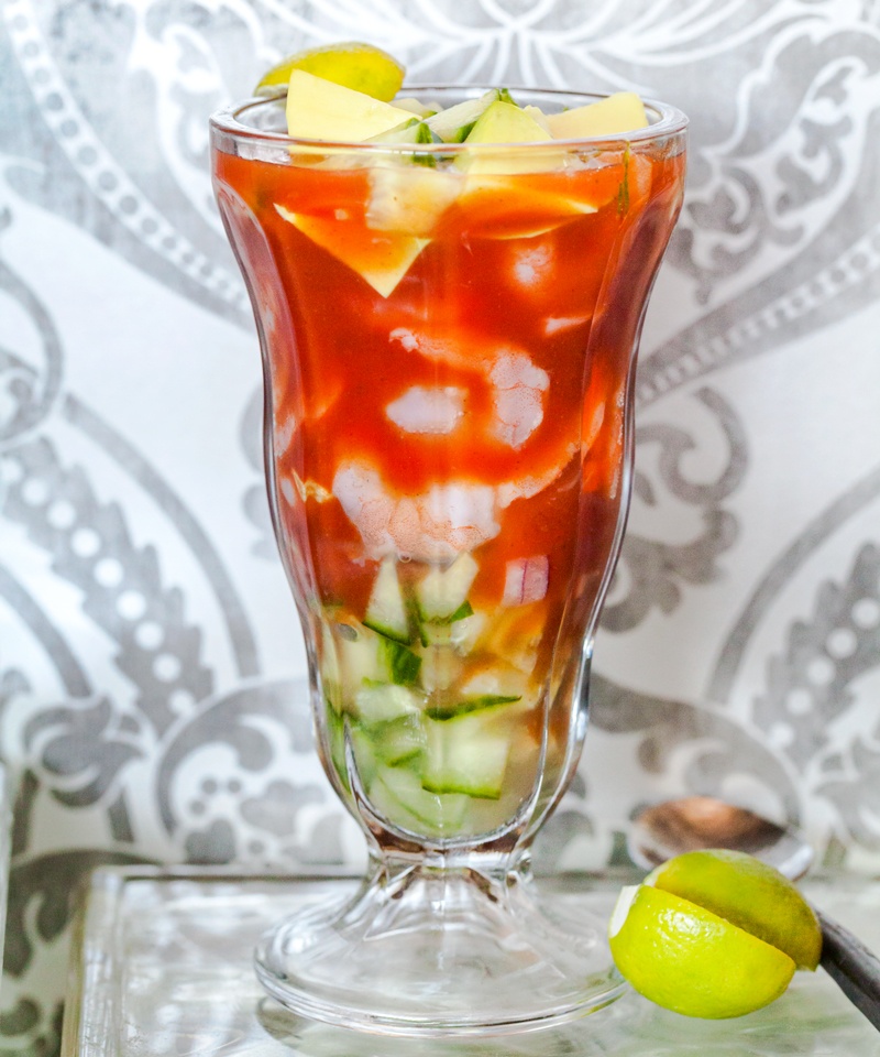 Mexican shrimp cocktail served in a soda glass with avocado and lime from the Taste of Tucson cookbook by Jackie Alpers