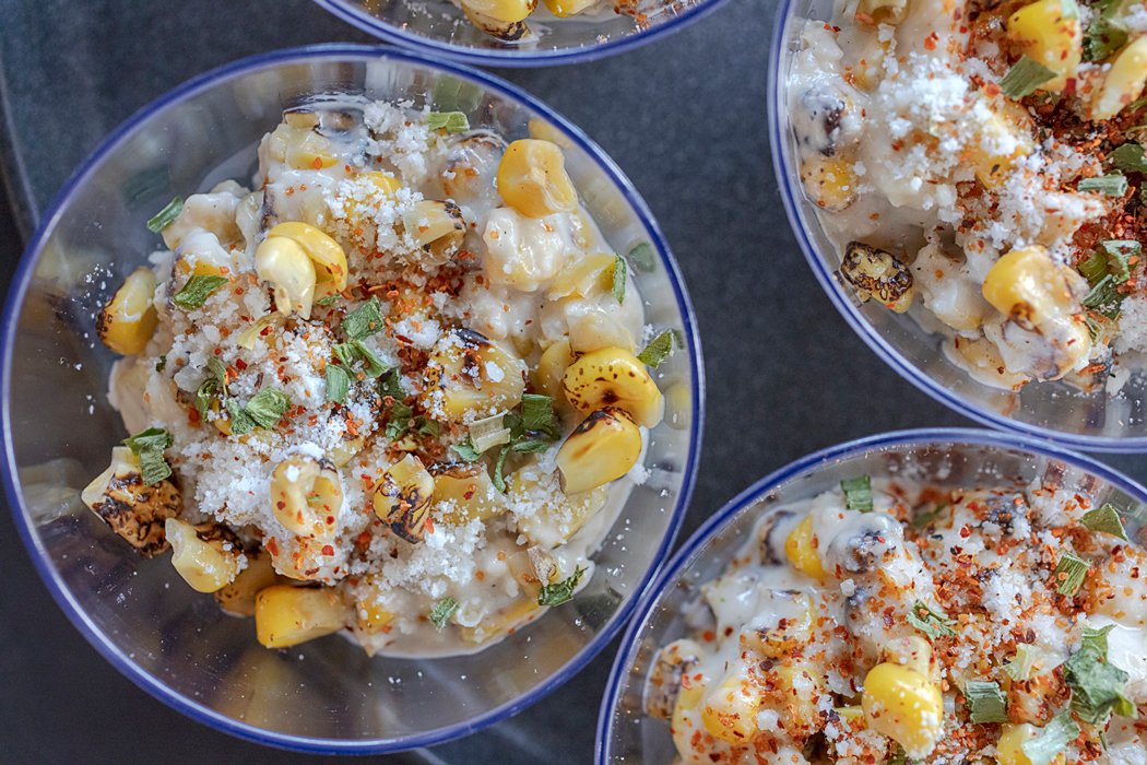 Mexican street corn roasted corn kernels in a cheesy, creamy sauce