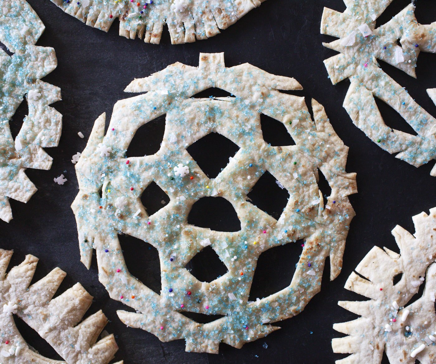 crunchy snowflakes made out of tortillas and sprinkles which resemble papel picado