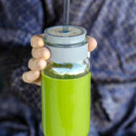 Yellowstone tribue recipe of a man in a bathrobe holding a green smoothie.