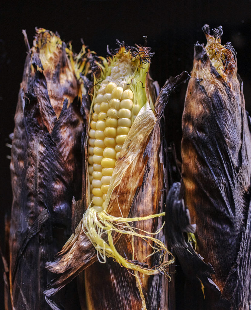 The secret to perfectly grilled campfire corn in their husks by The Unofficial Yellowstone Cookbook author Jackie Alpers.