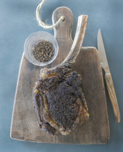 Recipe photo for coffee rubbed tomahawk steaks from The Unofficial Yellowstone Cookbook by Jackie Alpers