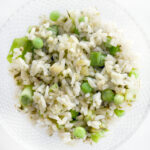 green rice with peas, green onions, salsa verde, and Mexican Oregano
