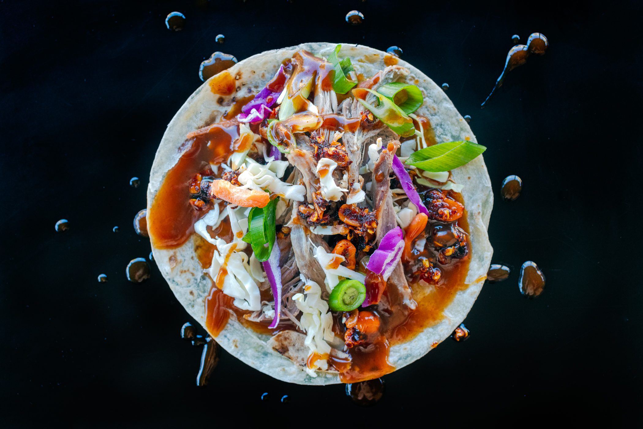 Peking-inspired Sonoran-style roast goose tacos with shredded cabbage, carrots, Salsa Macha and hoisin sauce. Food photography and recipe by Jackie Alpers.