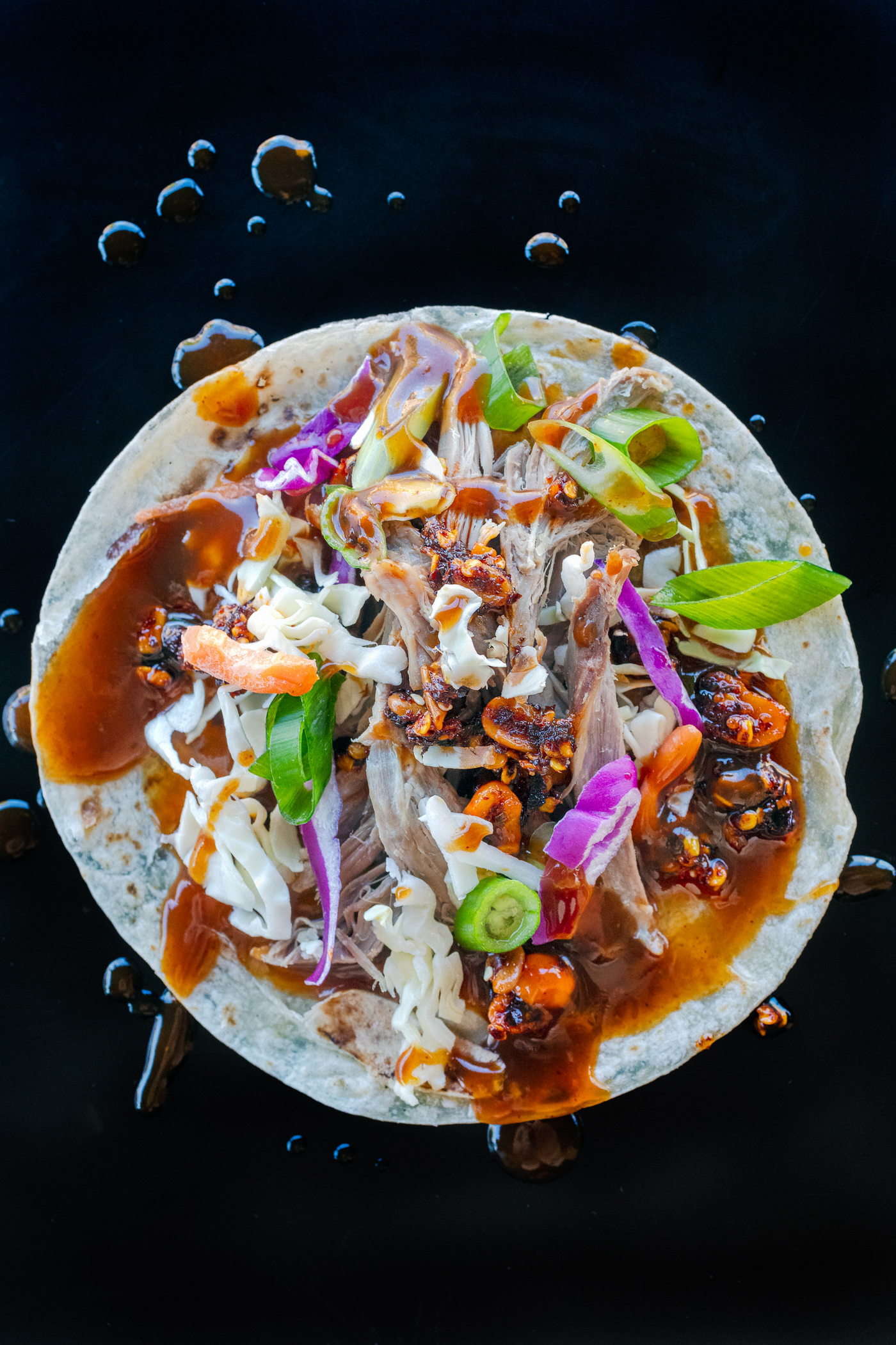 Peking-inspired Sonoran-style roast goose tacos with shredded cabbage, carrots, Salsa Macha and hoisin sauce. Food photography and recipe by Jackie Alpers.