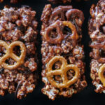 Salty-spicy-sweet no-bake Sonoran-style Mexican chocolate popcorn cakes made with popcorn, pretzels, cashews, Sriracha sesame seeds combined with a cinnamon and red chile spiced chocolate marshmallow cream.