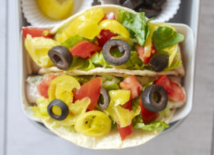 Turkey Provolone Deli Meat Tacos with special sauce, lettuce, pepperoncini, olives and tomatoes. Recipe and food photography by Jackie Alpers for The Silicone Kitchen.