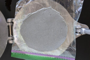 How to make blue corn tortillas step 5 flatten: recipe and food photography by Sonoran cookbook author Jackie Alpers.