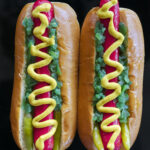 The Kringle 3000 hot dog Inspired by the engine that fuels Santa's sled in the movie Elf. Red Snapper hot dogs, bright green relish, sport peppers and yellow mustard.