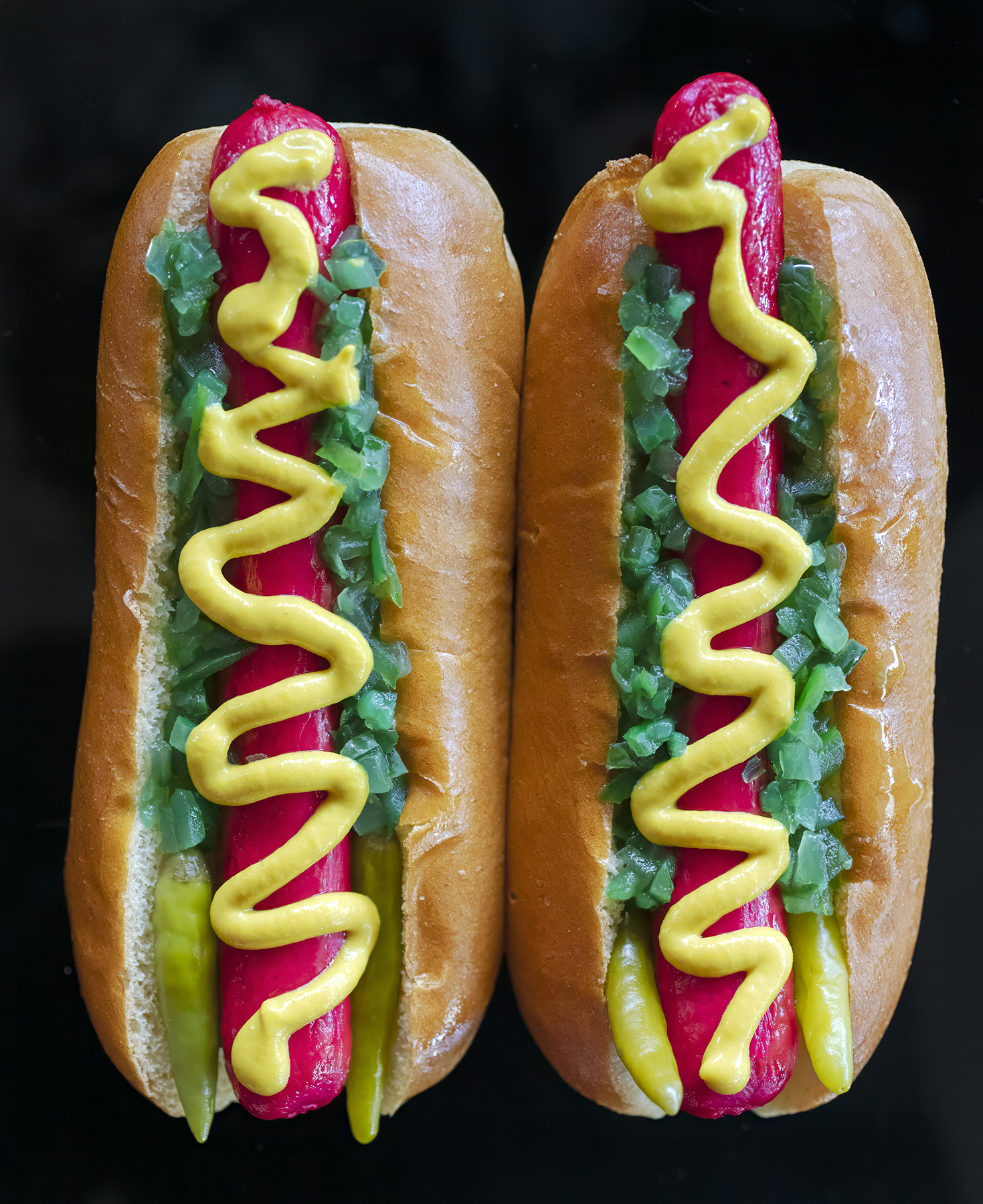 The Kringle 3000 hot dog Inspired by the engine that fuels Santa's sled in the movie Elf. Red Snapper hot dogs, bright green relish, sport peppers and yellow mustard.