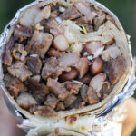 Burritos stuffed with Sonoran-style carne asada, charro beans, crunchy cabbage. Served with Jackie's famous chiltepin red salsa. This is one way we do beef and bean burritos in the Sonoran region north of the Arizona-Mexico border.