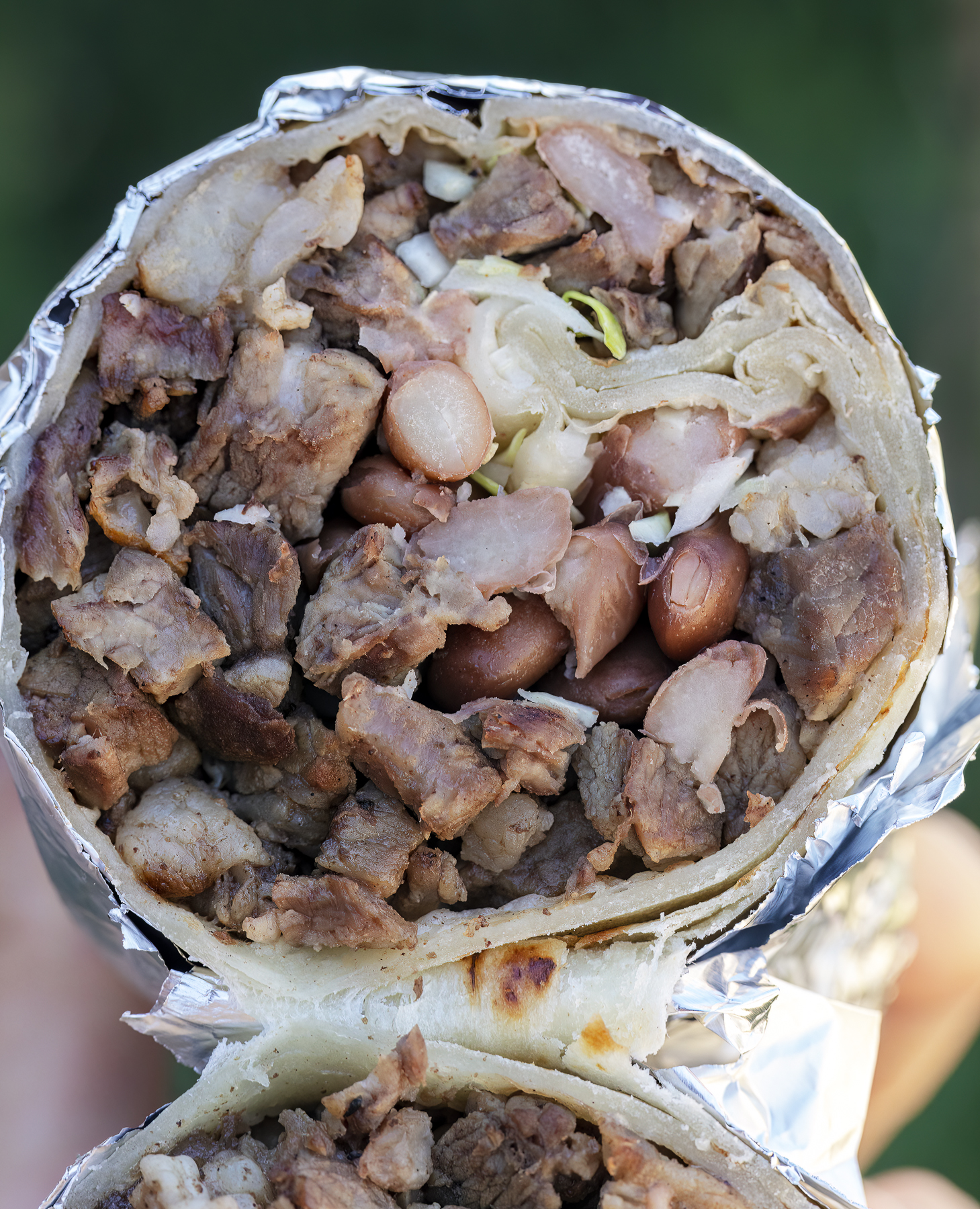 Burritos stuffed with Sonoran-style carne asada, charro beans, crunchy cabbage. Served with Jackie's famous chiltepin red salsa. This is one way we do beef and bean burritos in the Sonoran region north of the Arizona-Mexico border.