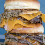 Double Smash Burgers with Cheese and Bourbon Braised Onions. Recipe and photo by Jackie Alpers