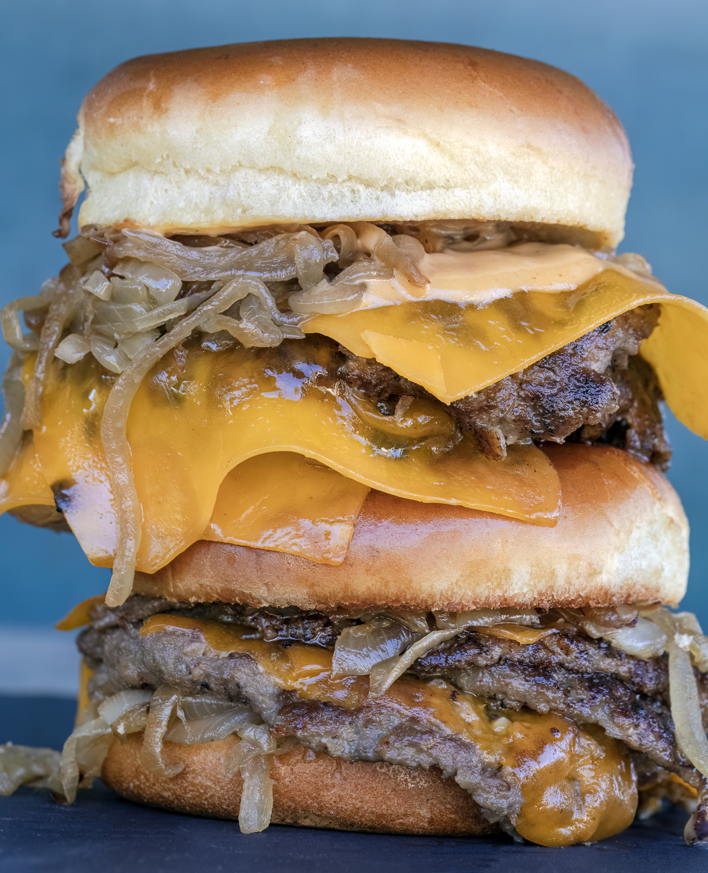 Double Smash Burgers with Cheese and Bourbon Braised Onions. Recipe and photo by Jackie Alpers